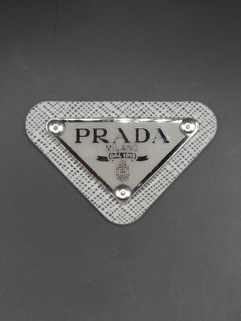 Light Gray Prada Triangle Patch/Croc Charm